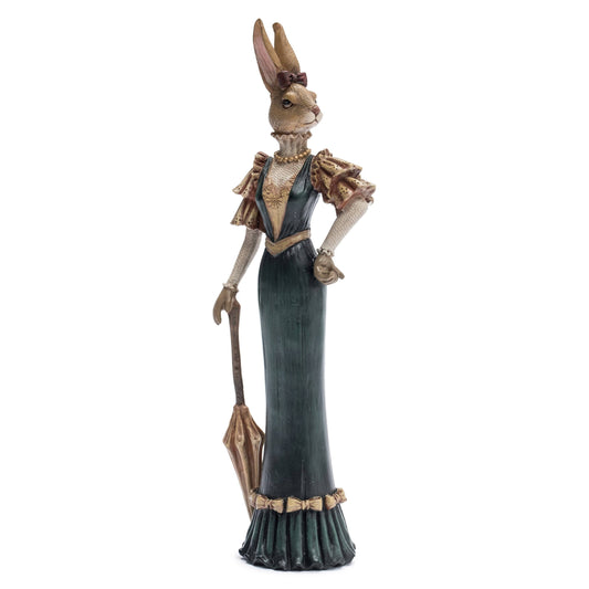 Statue of a rabbit figure in a formal gown with a hat on a white background