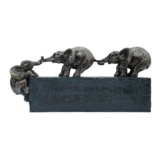 Bronze sculpture of three elephants on a black base