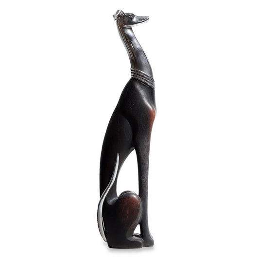 Black and brown dog figurine on a white background